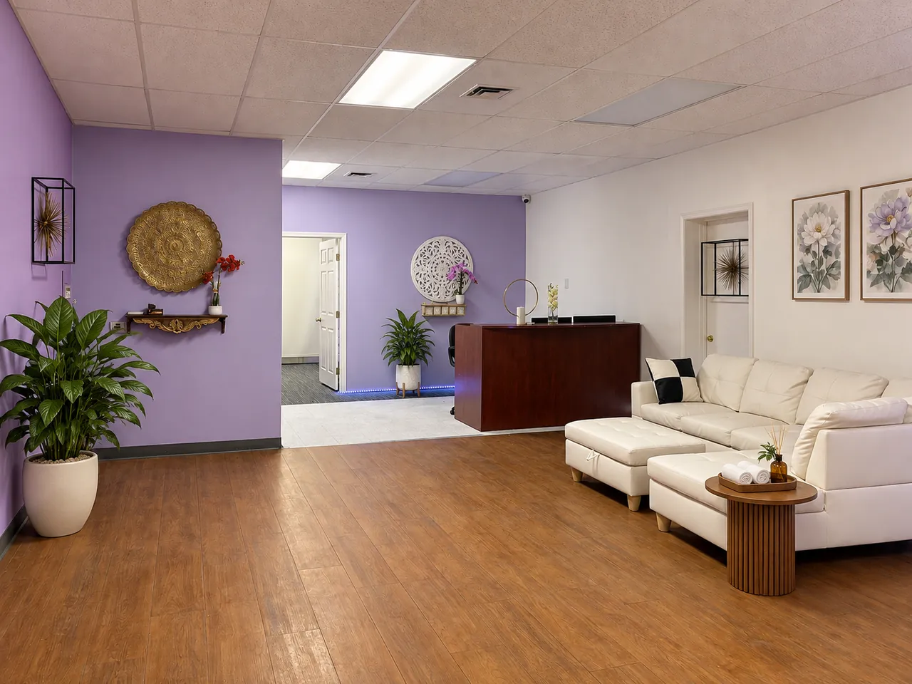 Lobby with lavender walls, a white sofa and the front counter inside Desert Asian Spa in Las Vegas, NV